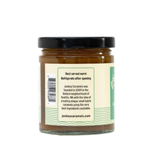 Load image into Gallery viewer, Side of view of vegan caramel sauce jar with description of Jonboy Boy Caramel company info. "Best served warm. Refrigerate after opening."